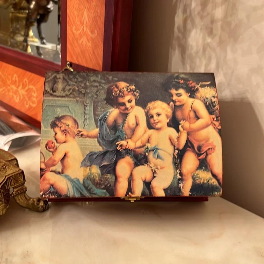 Vintage lacquer jewelry box with angels depicted